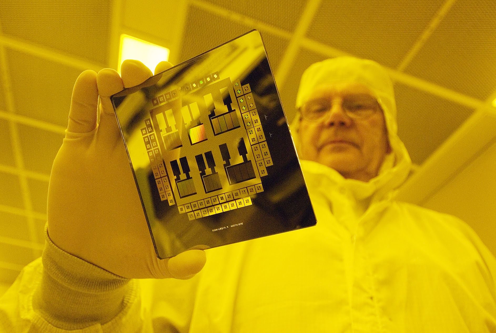 Stanford Nanofabrication Facility staff member examines a finished micronic mask maker. Credit Linda A. Cicero / Stanford News Service SNF Mask